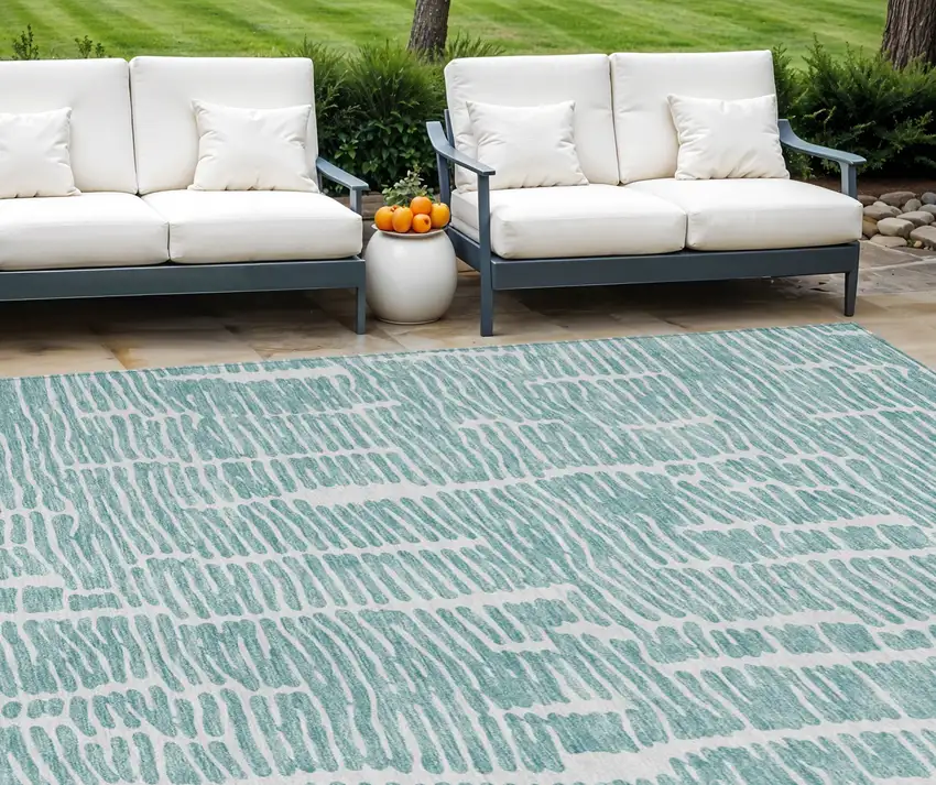 Teal Blue And Ivory Abstract Washable Indoor Outdoor Area Rug Photo 1