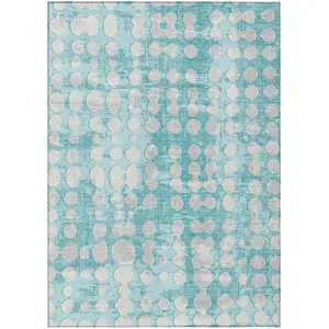 Photo of Teal Blue And Ivory Abstract Washable Indoor Outdoor Area Rug