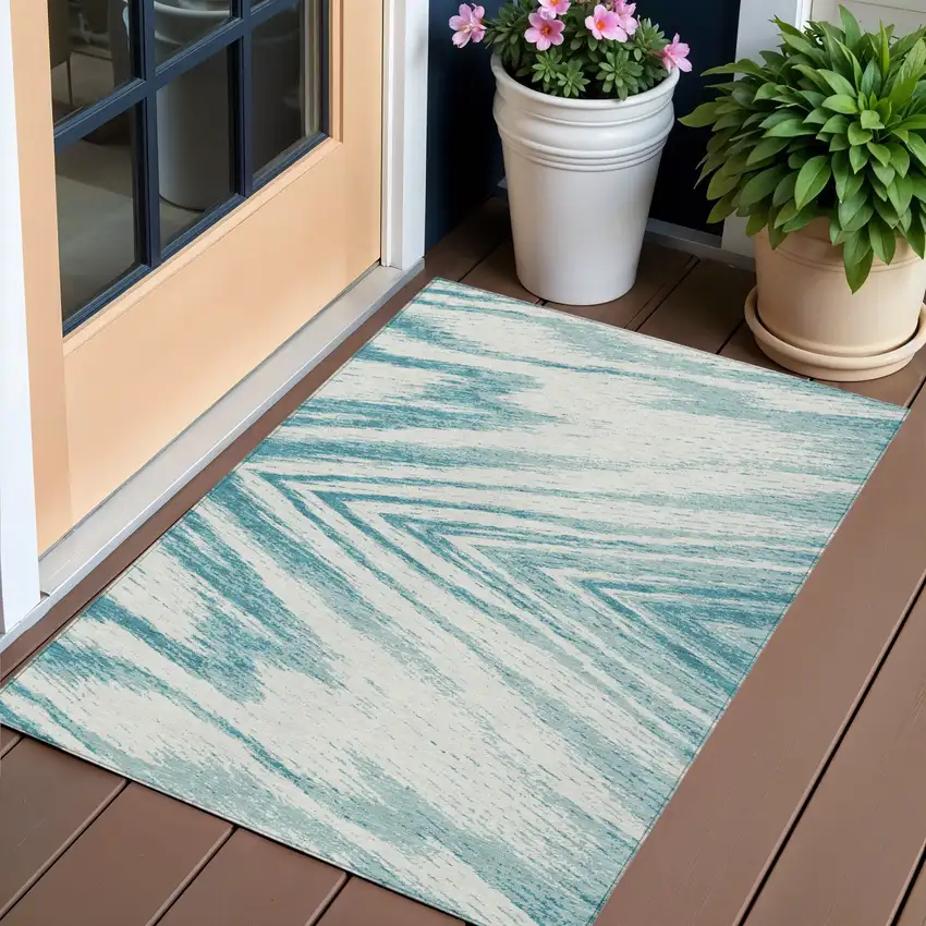 Teal Blue And Ivory Abstract Washable Indoor Outdoor Area Rug Photo 1