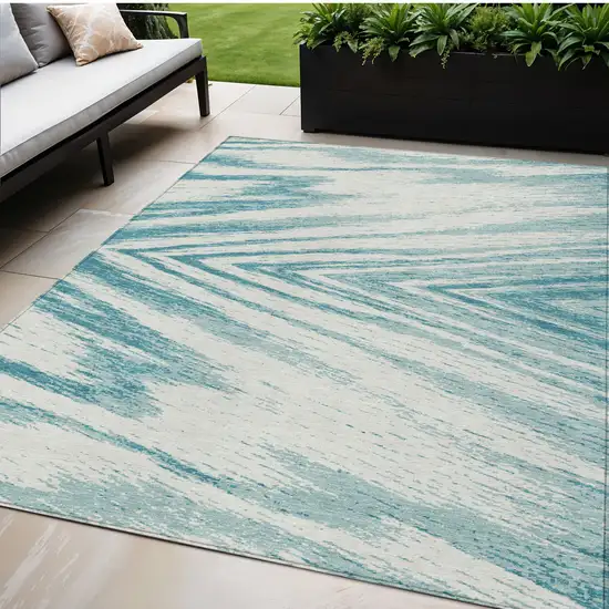 Teal Blue And Ivory Abstract Washable Indoor Outdoor Area Rug Photo 1