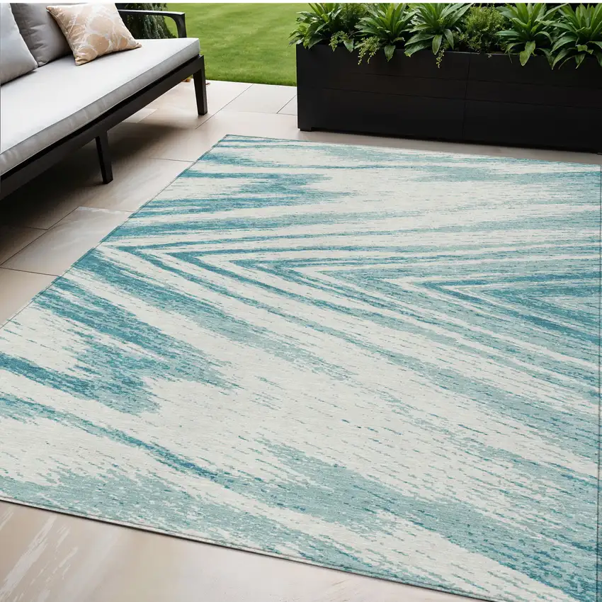 Teal Blue And Ivory Abstract Washable Indoor Outdoor Area Rug Photo 1