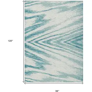 Photo of Teal Blue And Ivory Abstract Washable Indoor Outdoor Area Rug