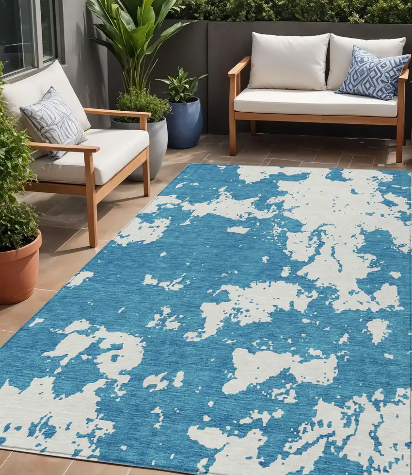Teal Blue And Ivory Abstract Washable Indoor Outdoor Area Rug Photo 1