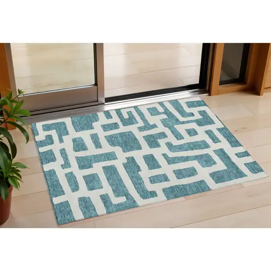 Teal Blue And Ivory Abstract Washable Indoor Outdoor Area Rug Photo 1