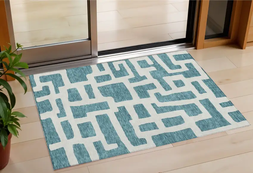 Teal Blue And Ivory Abstract Washable Indoor Outdoor Area Rug Photo 1