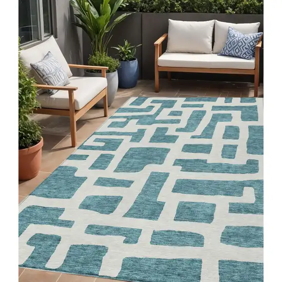 Teal Blue And Ivory Abstract Washable Indoor Outdoor Area Rug Photo 1
