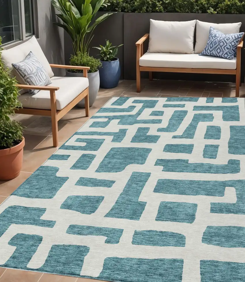 Teal Blue And Ivory Abstract Washable Indoor Outdoor Area Rug Photo 1