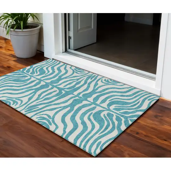 Teal Blue And Ivory Animal Print Washable Indoor Outdoor Area Rug Photo 1