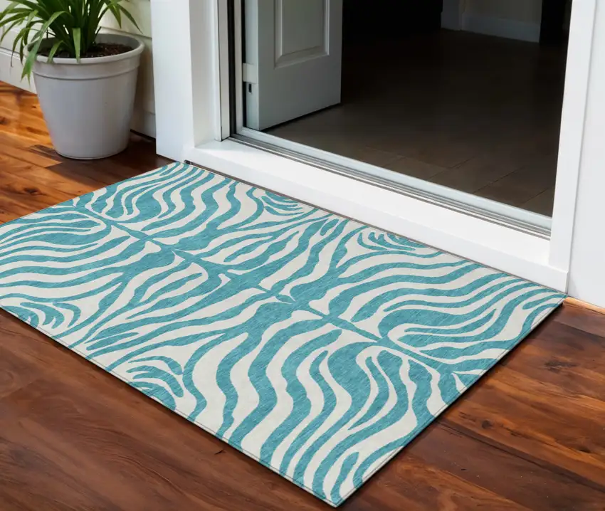 Teal Blue And Ivory Animal Print Washable Indoor Outdoor Area Rug Photo 1