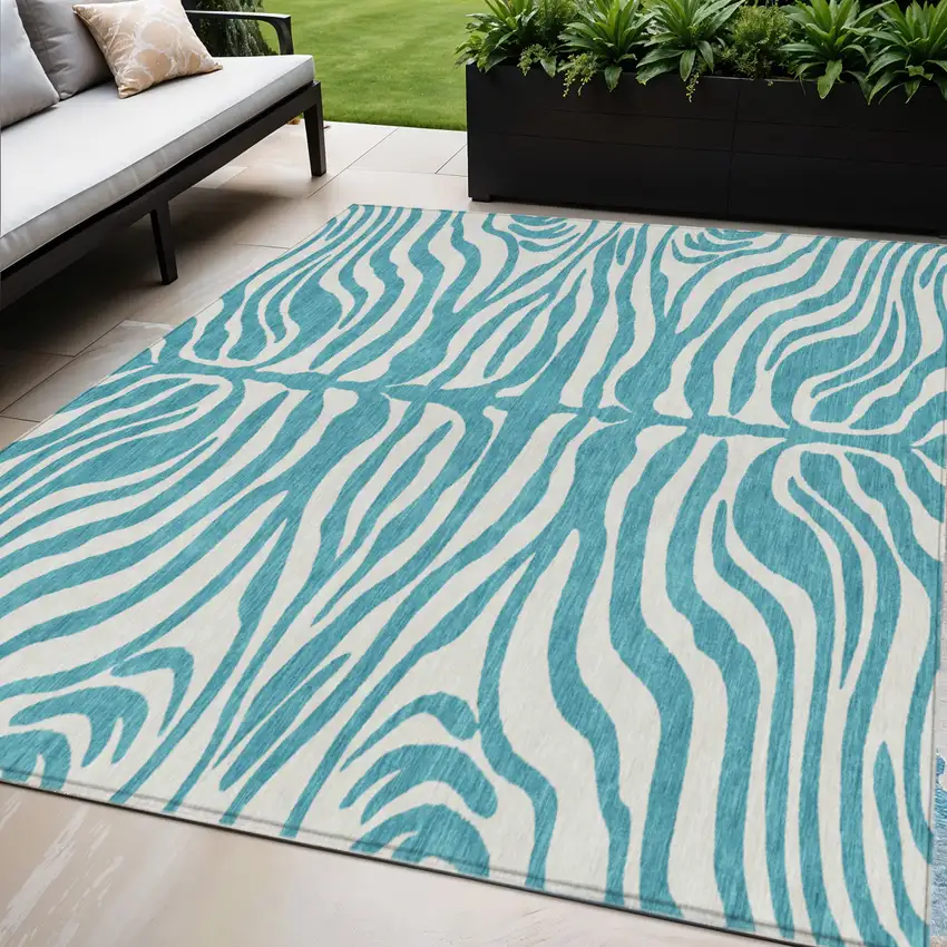 Teal Blue And Ivory Animal Print Washable Indoor Outdoor Area Rug Photo 1