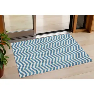 Photo of Teal Blue And Ivory Chevron Washable Indoor Outdoor Area Rug