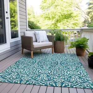 Photo of Teal Blue And Ivory Damask Washable Indoor Outdoor Area Rug