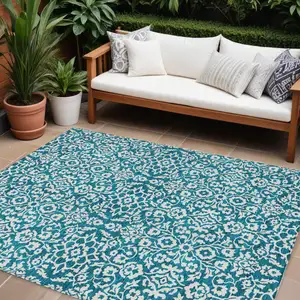 Photo of Teal Blue And Ivory Damask Washable Indoor Outdoor Area Rug