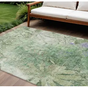 Photo of Teal Blue And Ivory Floral Washable Indoor Outdoor Area Rug