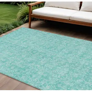 Photo of Teal Blue And Ivory Floral Washable Indoor Outdoor Area Rug