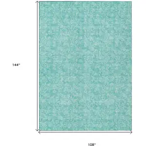 Photo of Teal Blue And Ivory Floral Washable Indoor Outdoor Area Rug