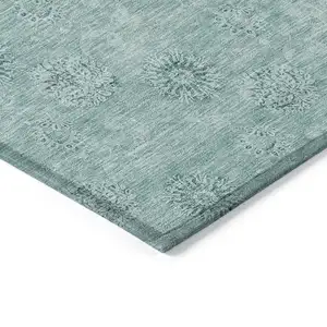 Photo of Teal Blue And Ivory Floral Washable Indoor Outdoor Area Rug