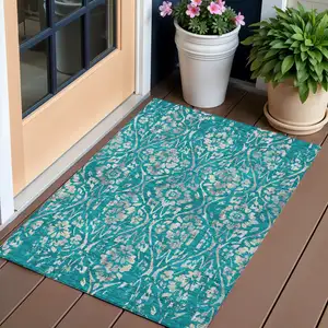 Photo of Teal Blue And Ivory Floral Washable Indoor Outdoor Area Rug