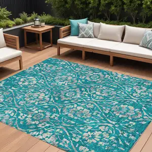 Photo of Teal Blue And Ivory Floral Washable Indoor Outdoor Area Rug