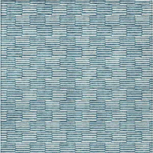 Photo of Teal Blue And Ivory Geometric Washable Indoor Outdoor Area Rug