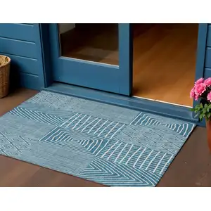 Photo of Teal Blue And Ivory Geometric Washable Indoor Outdoor Area Rug