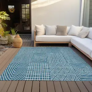 Photo of Teal Blue And Ivory Geometric Washable Indoor Outdoor Area Rug