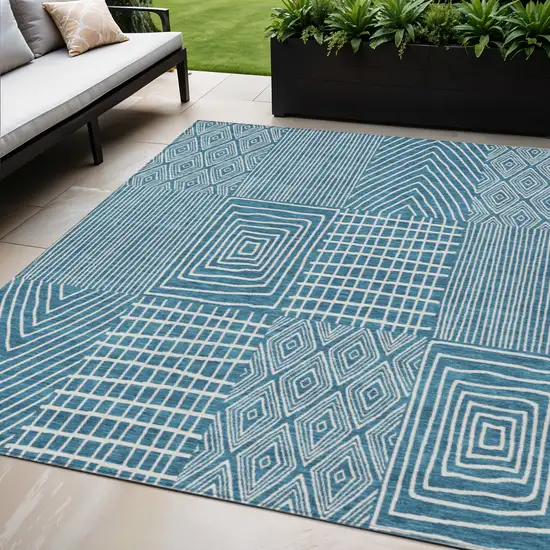Teal Blue And Ivory Geometric Washable Indoor Outdoor Area Rug Photo 1