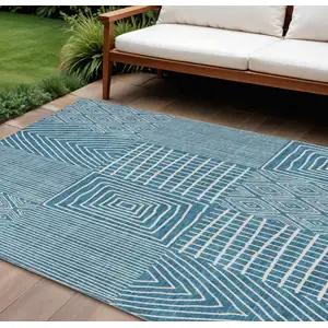 Photo of Teal Blue And Ivory Geometric Washable Indoor Outdoor Area Rug