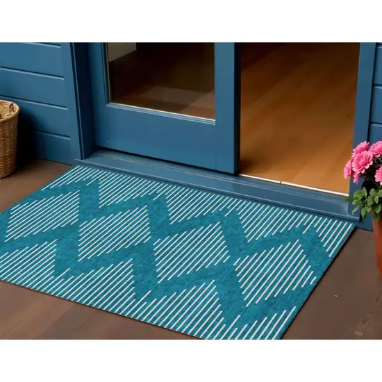 Teal Blue And Ivory Geometric Washable Indoor Outdoor Area Rug Photo 1