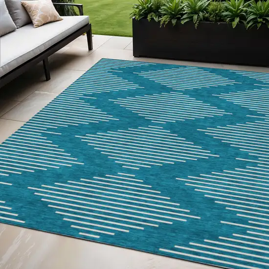 Teal Blue And Ivory Geometric Washable Indoor Outdoor Area Rug Photo 1
