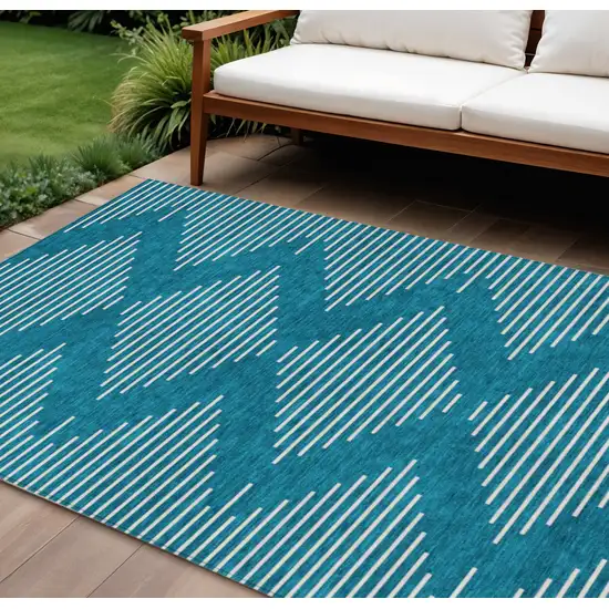 Teal Blue And Ivory Geometric Washable Indoor Outdoor Area Rug Photo 1