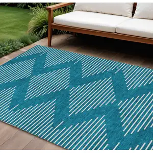 Photo of Teal Blue And Ivory Geometric Washable Indoor Outdoor Area Rug