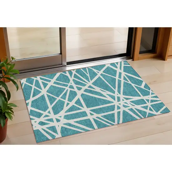 Teal Blue And Ivory Geometric Washable Indoor Outdoor Area Rug Photo 1