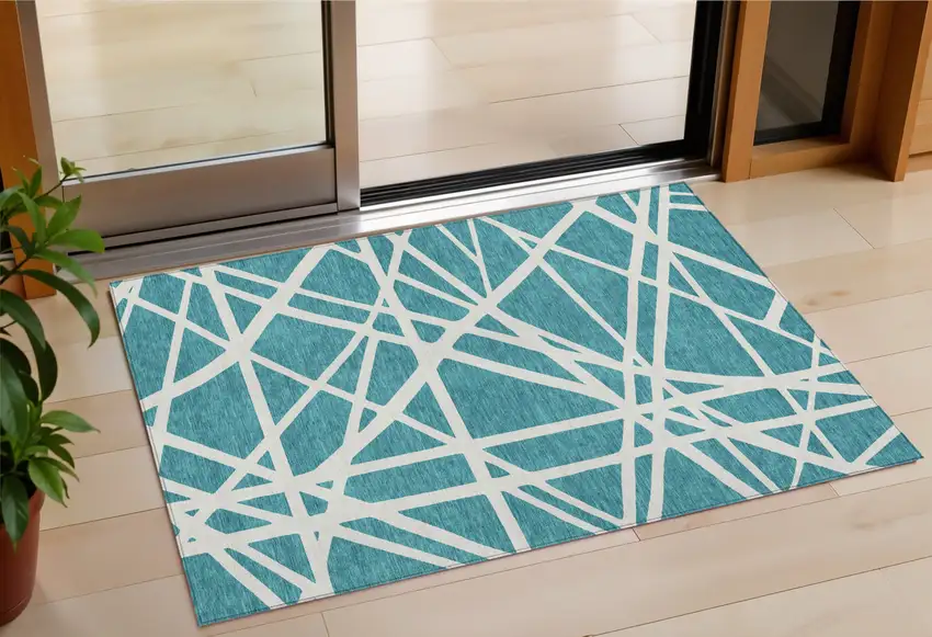 Teal Blue And Ivory Geometric Washable Indoor Outdoor Area Rug Photo 1