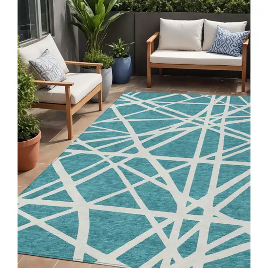 Teal Blue And Ivory Geometric Washable Indoor Outdoor Area Rug Photo 1
