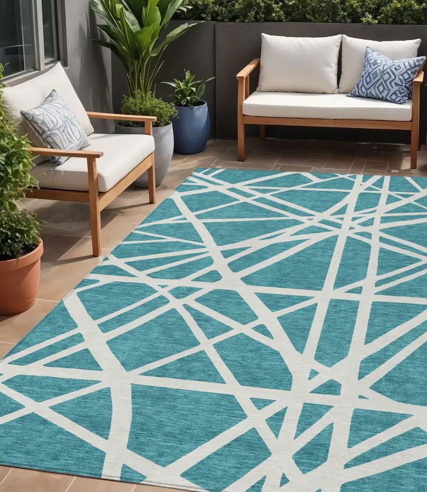 Teal Blue And Ivory Geometric Washable Indoor Outdoor Area Rug Photo 1