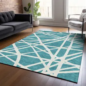 Photo of Teal Blue And Ivory Geometric Washable Indoor Outdoor Area Rug