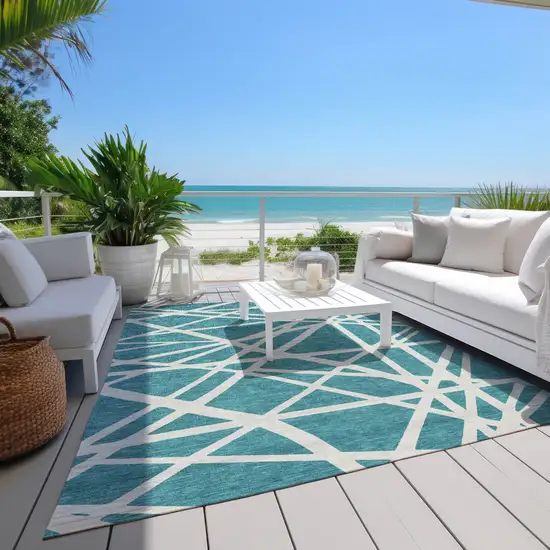 Teal Blue And Ivory Geometric Washable Indoor Outdoor Area Rug Photo 9