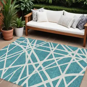 Photo of Teal Blue And Ivory Geometric Washable Indoor Outdoor Area Rug