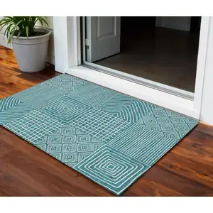 Photo of Teal Blue And Ivory Geometric Washable Indoor Outdoor Area Rug