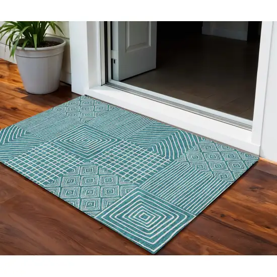 Teal Blue And Ivory Geometric Washable Indoor Outdoor Area Rug Photo 1