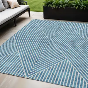 Photo of Teal Blue And Ivory Geometric Washable Indoor Outdoor Area Rug