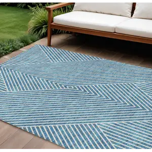 Photo of Teal Blue And Ivory Geometric Washable Indoor Outdoor Area Rug