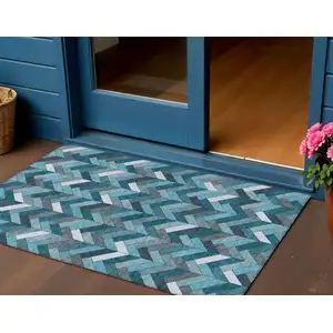 Photo of Teal Blue And Ivory Geometric Washable Indoor Outdoor Area Rug