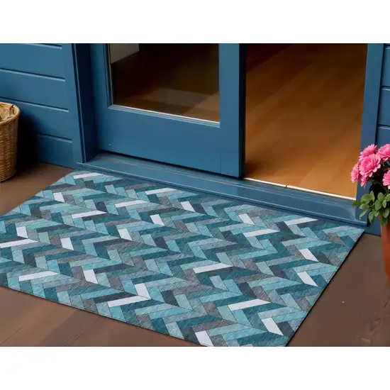 Teal Blue And Ivory Geometric Washable Indoor Outdoor Area Rug Photo 1
