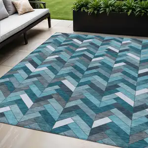 Photo of Teal Blue And Ivory Geometric Washable Indoor Outdoor Area Rug