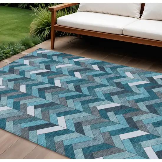 Teal Blue And Ivory Geometric Washable Indoor Outdoor Area Rug Photo 1