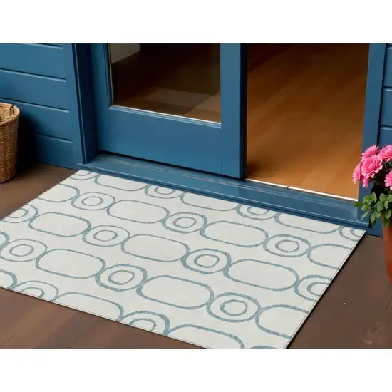 Teal Blue And Ivory Geometric Washable Indoor Outdoor Area Rug Photo 1