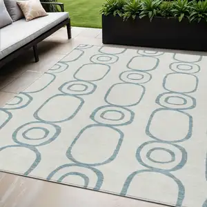 Photo of Teal Blue And Ivory Geometric Washable Indoor Outdoor Area Rug