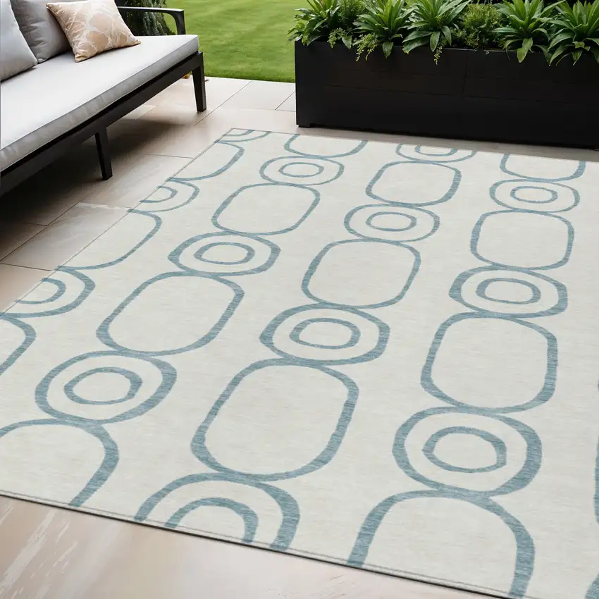 Teal Blue And Ivory Geometric Washable Indoor Outdoor Area Rug Photo 1